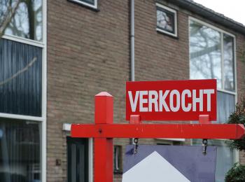 Huis met een te koop-bord